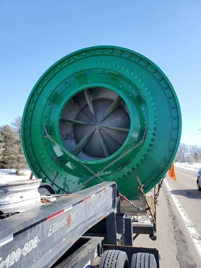An up close look at the end of a massive dryer strapped to a truck bed.
