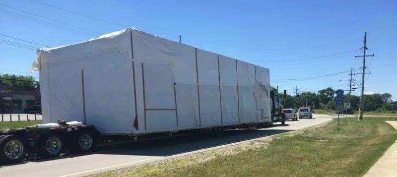 Close look at a prefabricated building on a truck.
