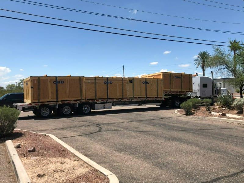 Four large crates on a truck bed.