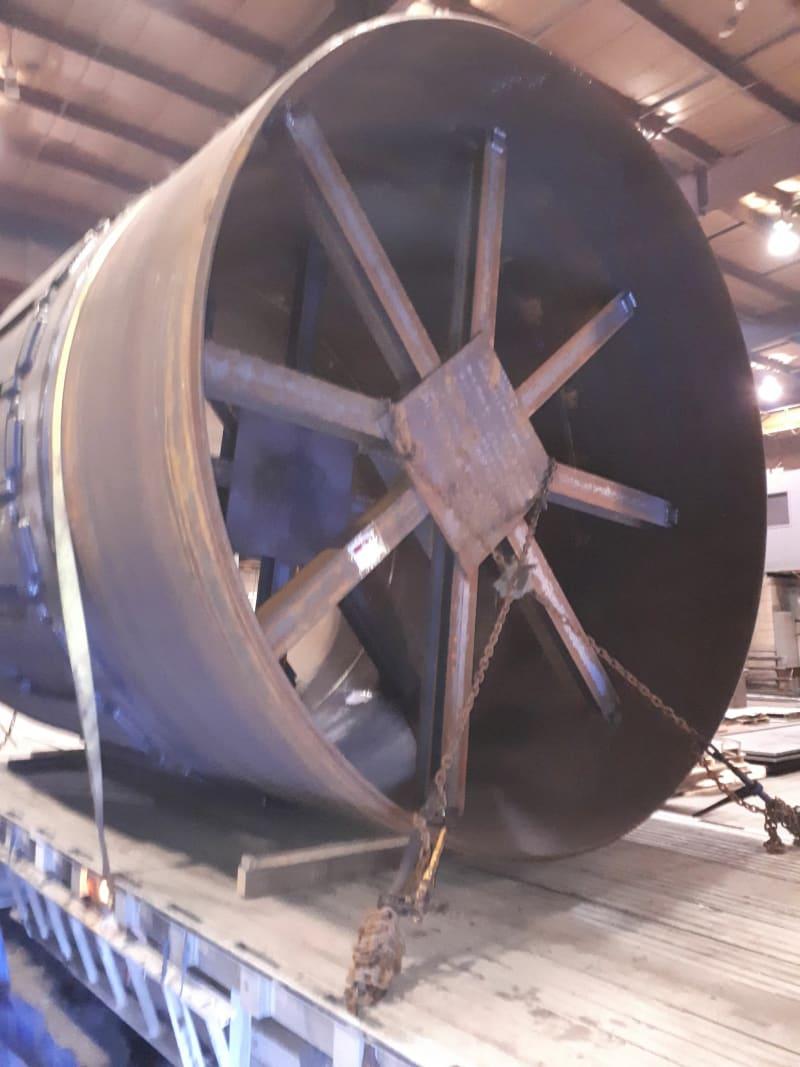The end of a thrust riding ring sits on a truck bed with straps around it.
