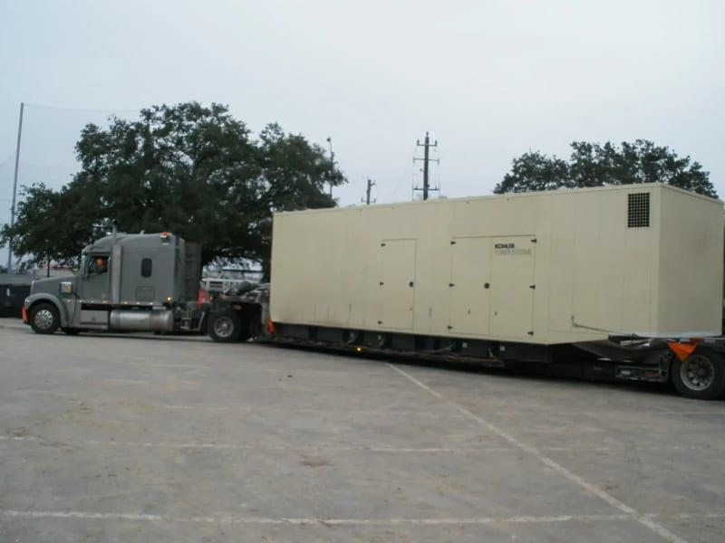 A generator on a truck in a parking lot