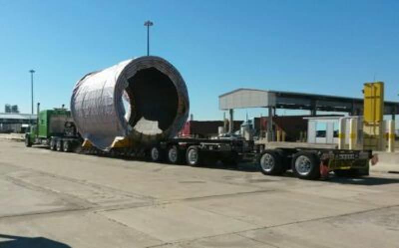 A large milling ring loaded onto a truck.