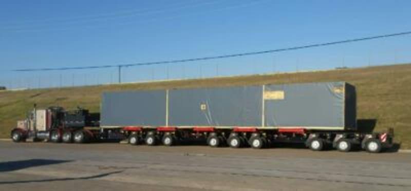 A large grey door motor on the back of a truck