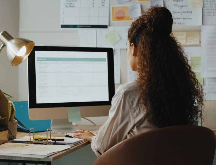 A ZMac customer sits facing a computer screen.